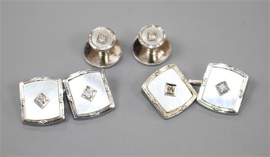 A pair of 9ct white gold, mother of pearl and diamond set cufflinks and two matching dress studs.